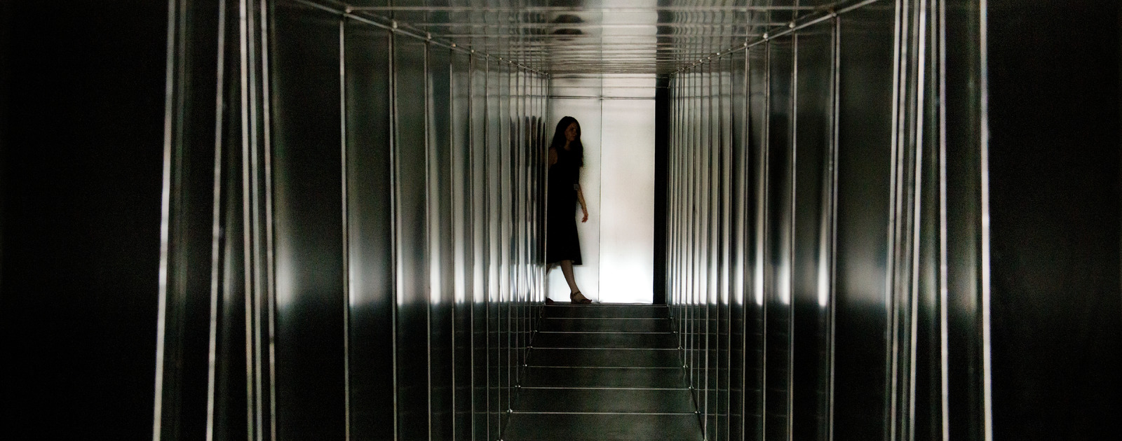 Decision Corridors installation by Carsten Höller 'Decision' Exhibition Hayward Gallery 2015 Girl at end of Metal Corridor installation by Carsten Höller in Hayward Gallery